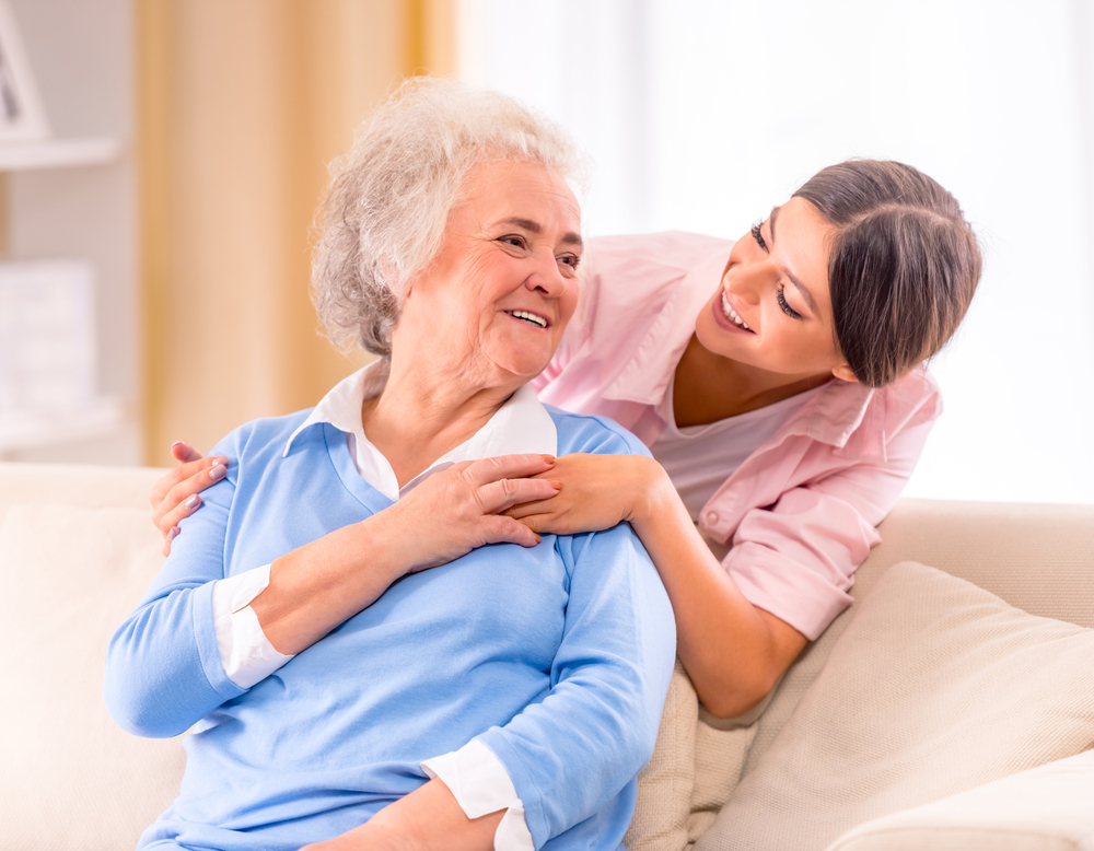 Care worker supporting an older adult